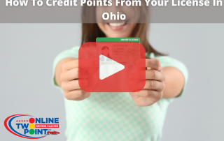 Woman holding license on hands.