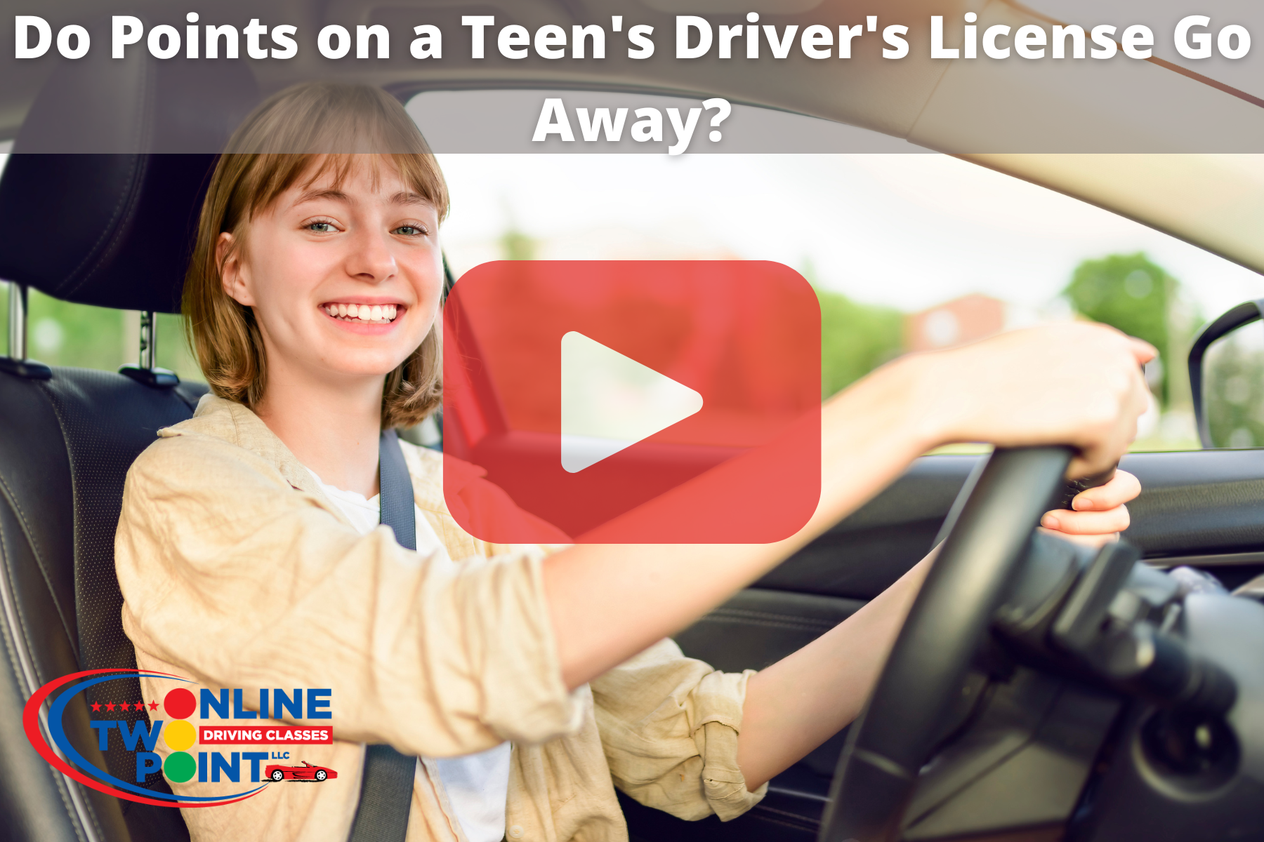 Young woman with seatbelt on in driver's seat with both hands on wheel and red play button overlayed on top.