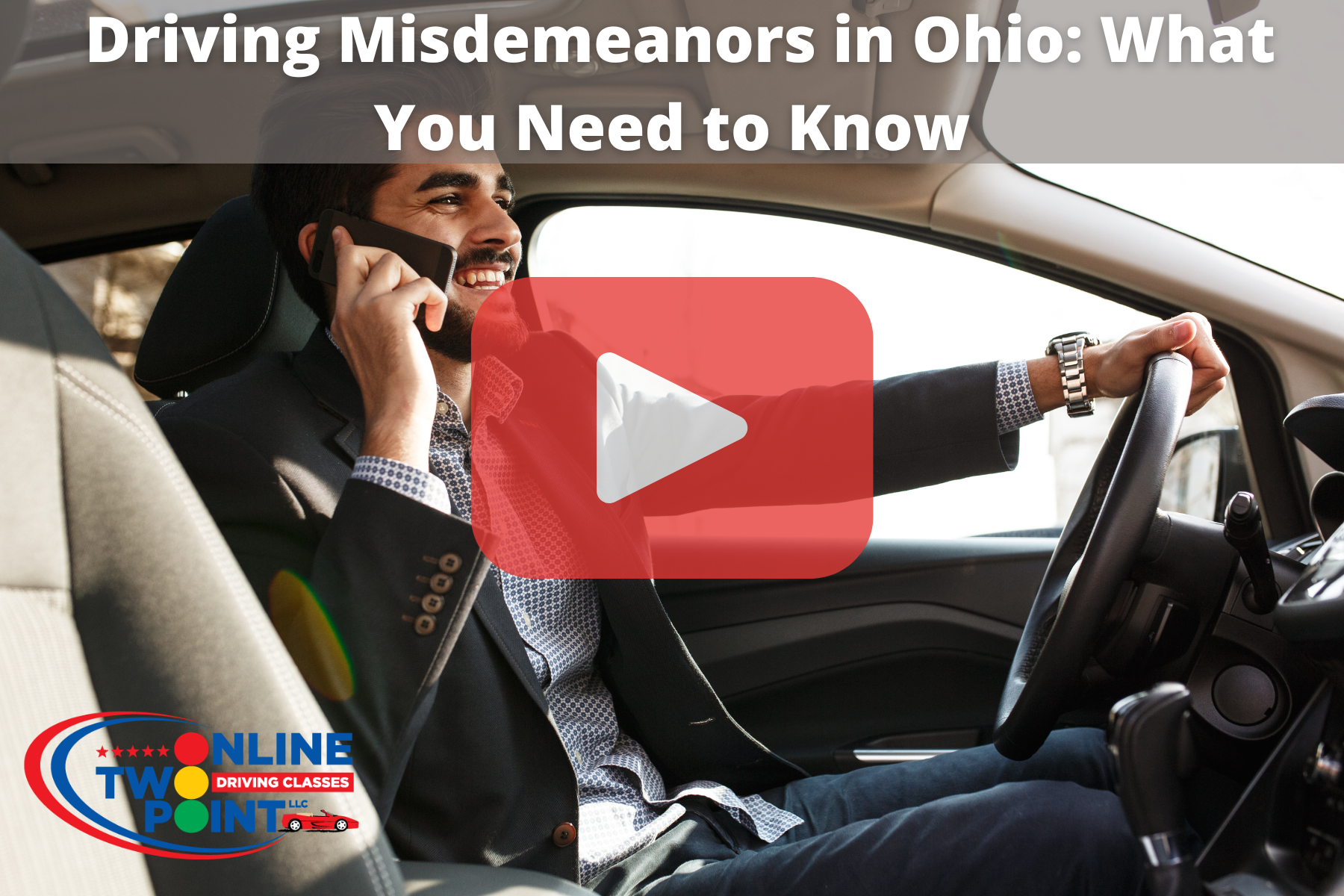 A man in a suit is smiling while driving and talking on the phone. The image includes a large play button overlay, indicating it's part of a video with the topic "Driving Misdemeanors in Ohio: What You Need to Know."