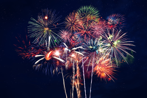 A vibrant and colorful explosion of fireworks lighting up the night sky, capturing a festive moment.
