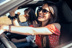 Woman smiling while driving.