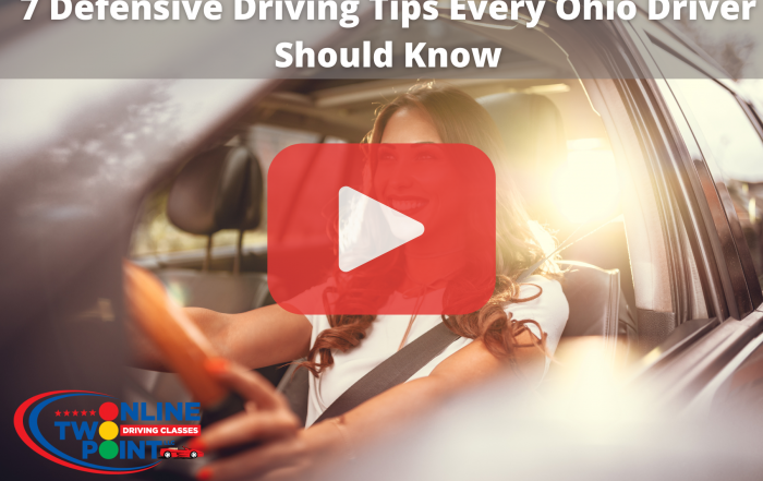 Woman smiling while driving car.