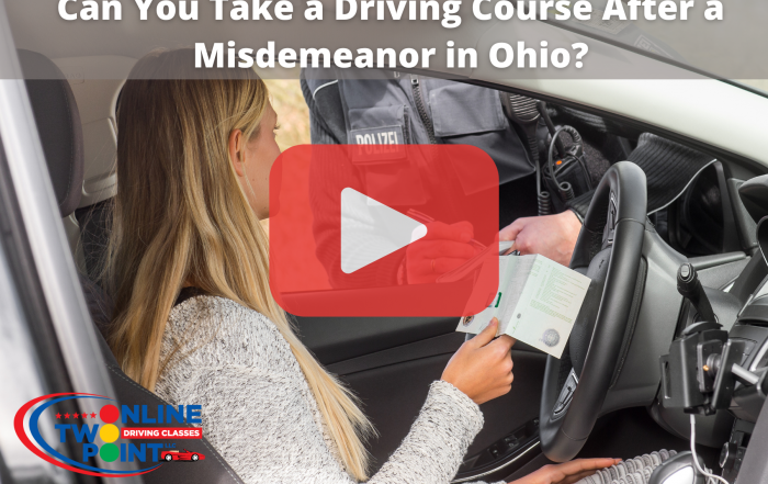 A person receiving a document from a police officer inside a car, with a "Can You Take a Driving Course After a Misdemeanor in Ohio?" video overlay.