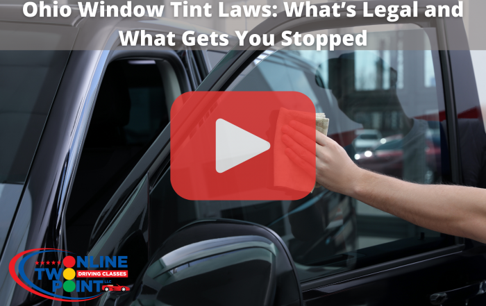 Car window with tint and red play button overlay.