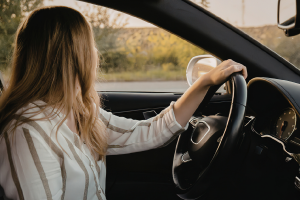 Woman looking out of car.