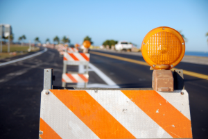 Sign on road. Construction on road. Work zone