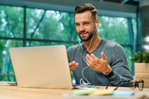 Man receving online class in laptop.